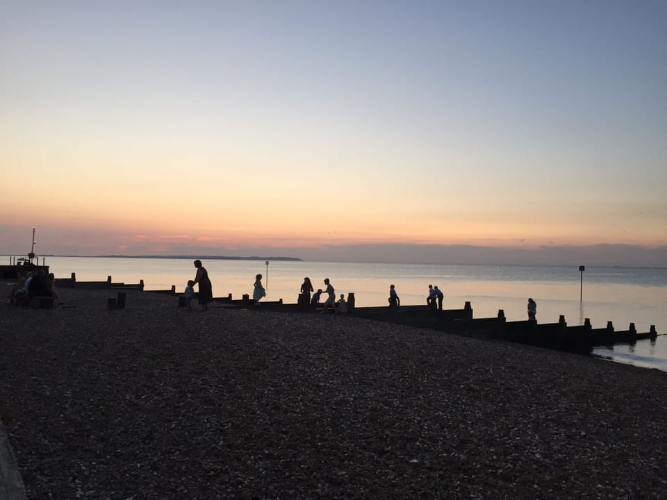 The sun going down on Whitstable Beach