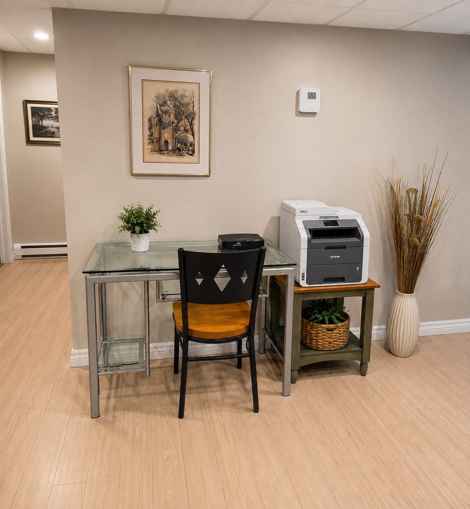 Dedicated workspace with desk, chair and printer for your convenience.