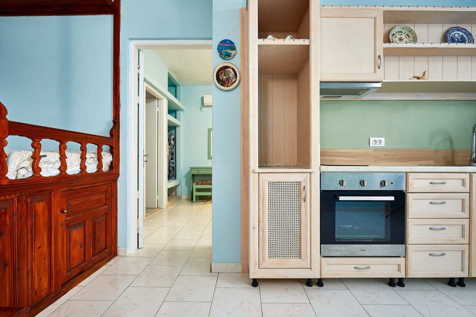 Apartment | Private kitchen | Fridge, stovetop, electric kettle, cookware/dishes/utensils