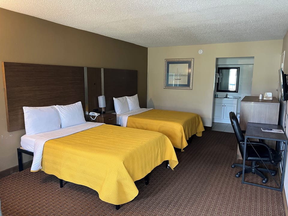 Desk, laptop workspace, blackout drapes, cribs (free)