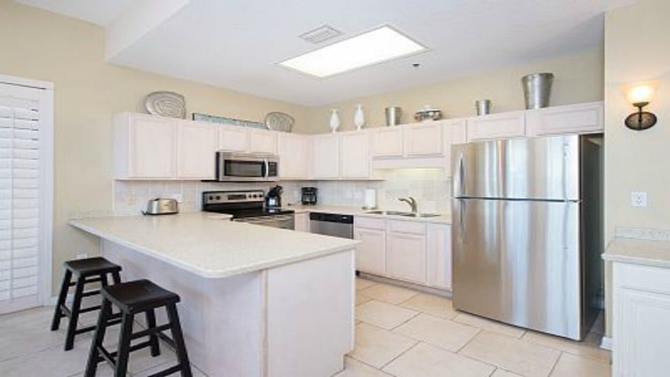 Kitchen with Corian Counters and Stainless Steel Appliances