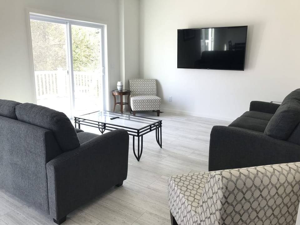 1st Living Room - with pullout couch and 65" large screen TV