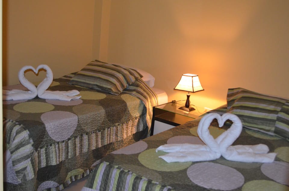 Twin Room, Shared Bathroom | Down comforters, in-room safe, desk, laptop workspace