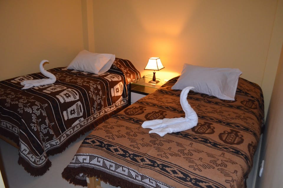 Twin Room, Shared Bathroom | Down comforters, in-room safe, desk, laptop workspace
