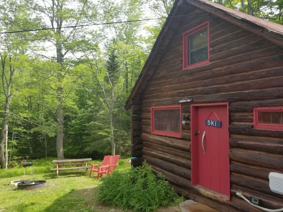 Great out door space, picnic table, charcoal and wood fire place with grate, hot tub, brook,