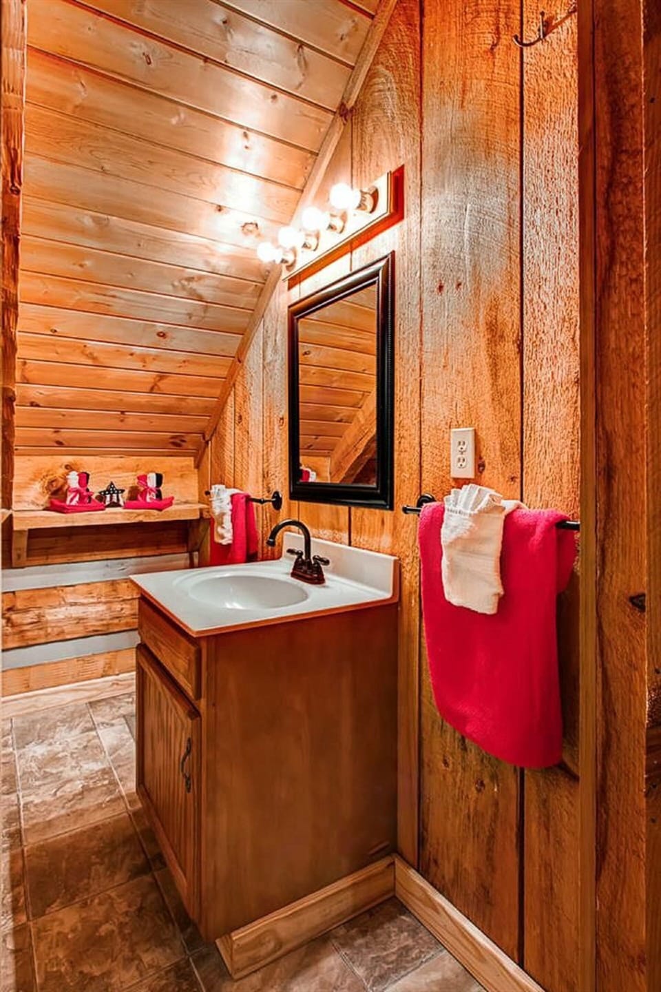 Upstairs bathroom features shower, vanity, and toilet.