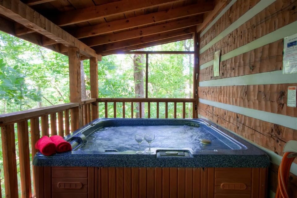 Relax in the hot tub after a great day in the Smokies on the large covered deck.