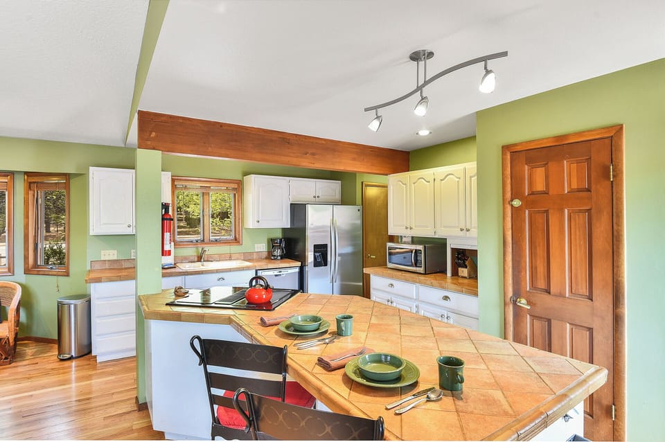 Extra seating at the bar with a full array of amenities in the kitchen