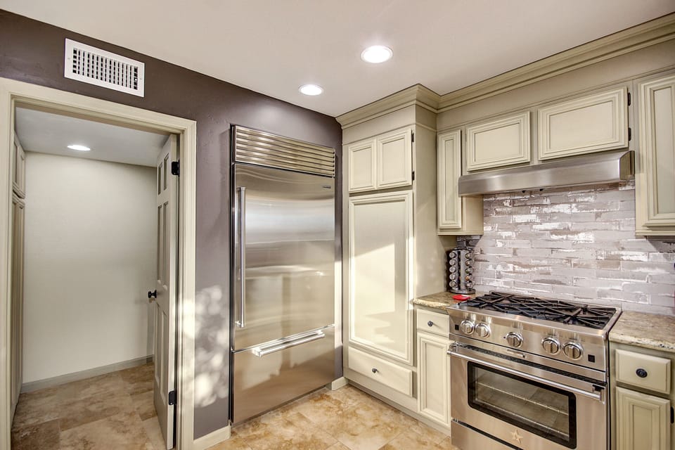 Chef's kitchen, w/granite counters, gas range & oven, sub zero fridge, pantry...