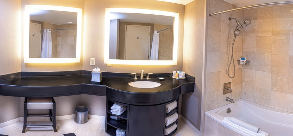 Combined shower/tub, designer toiletries, hair dryer, towels