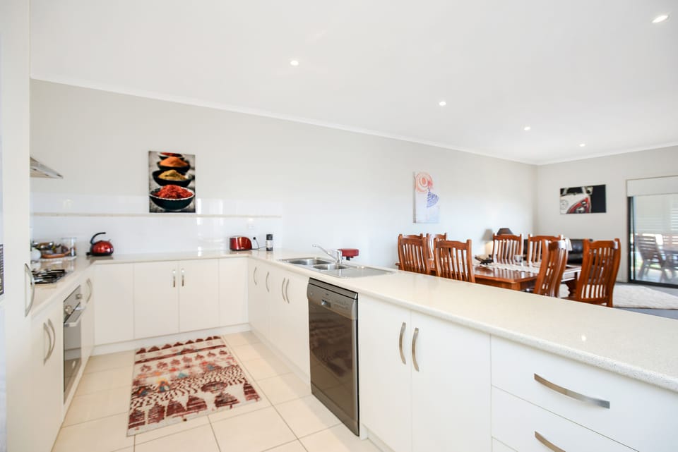 Bayside Holiday Home | Private kitchen | Fridge, microwave, oven, stovetop