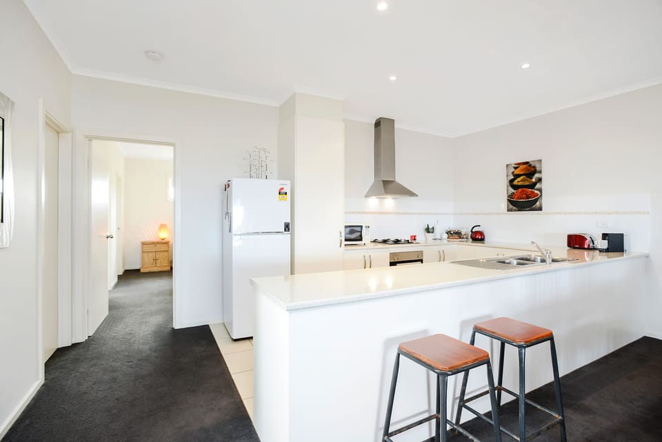 Bayside Holiday Home | Private kitchen | Fridge, microwave, oven, stovetop