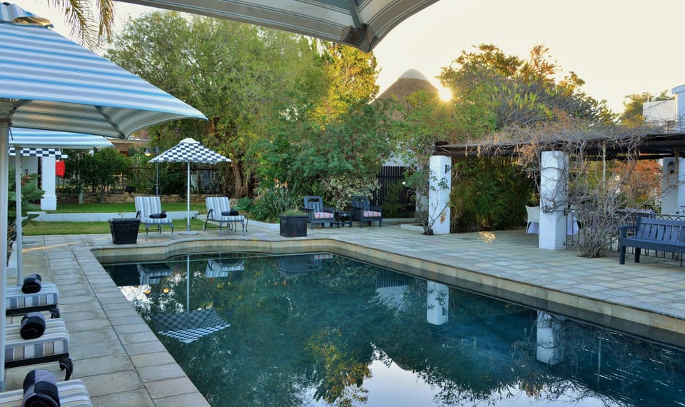 Outdoor pool, pool umbrellas, sun loungers