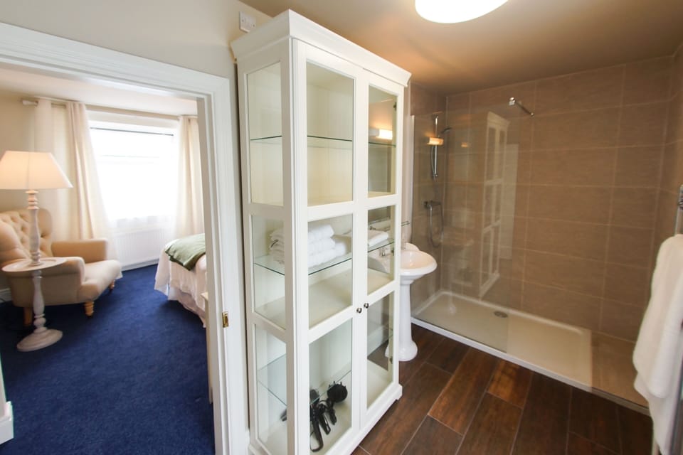 Bedroom 2: Ensuite bathroom with walk in shower, sink, toilet, heated towel rail