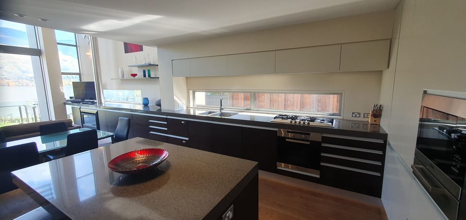 Three Bedroom Apartment" | Private kitchen | Full-size fridge, microwave, oven, stovetop