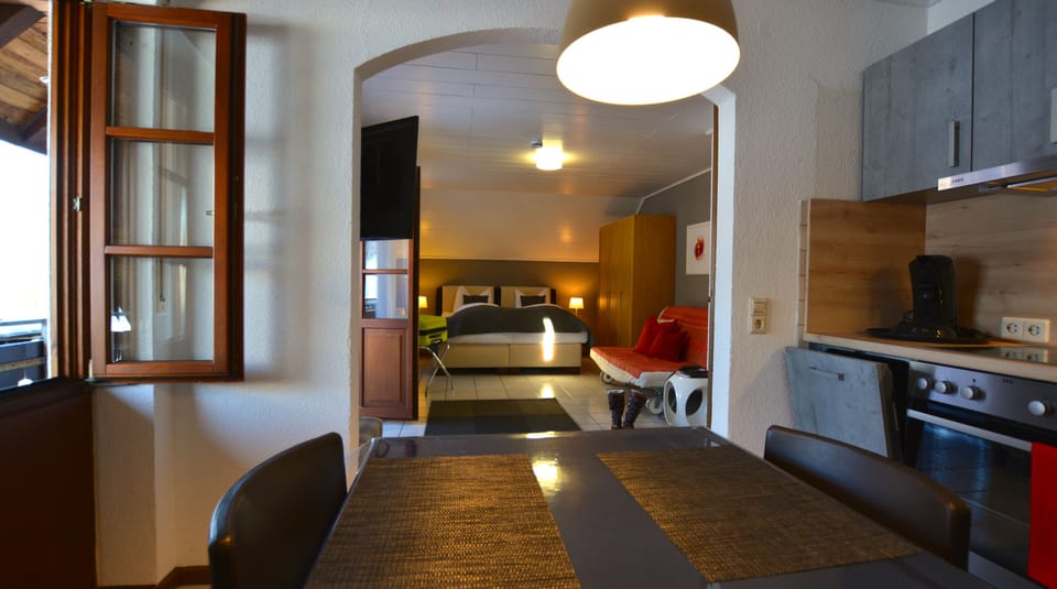 Suite | Premium bedding, desk, laptop workspace, blackout drapes