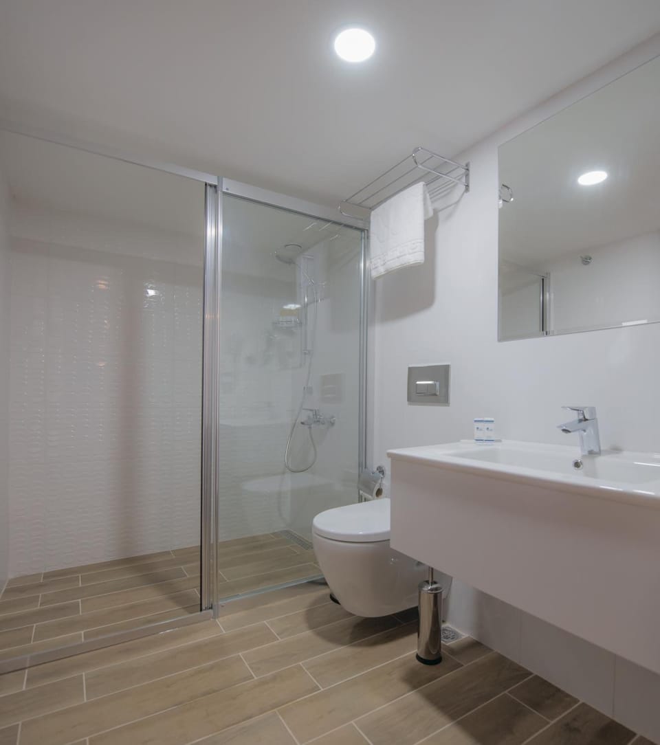 Shower, free toiletries, hair dryer, slippers
