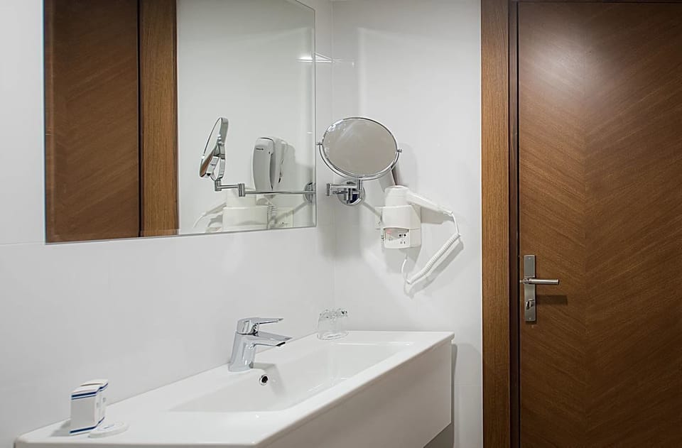 Shower, free toiletries, hair dryer, slippers