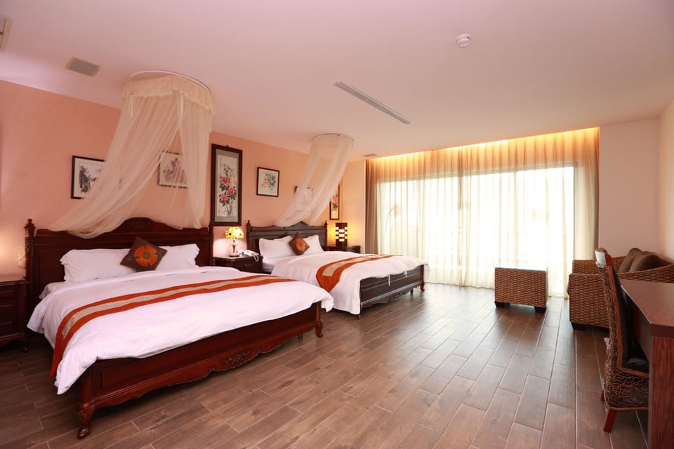Elite Quadruple Room | Premium bedding, down comforters, in-room safe, blackout drapes