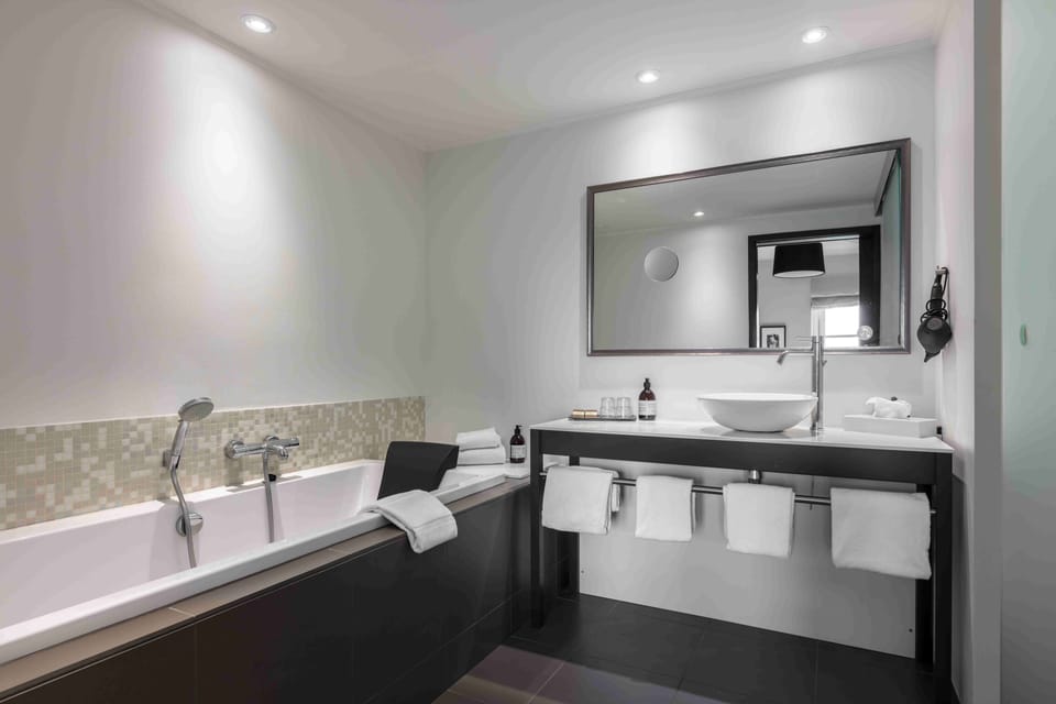 Shower, eco-friendly toiletries, hair dryer, towels