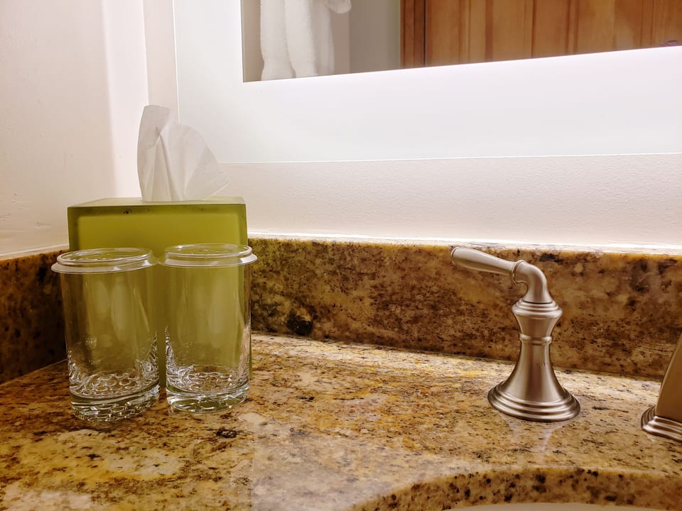 Combined shower/tub, designer toiletries, hair dryer, bathrobes