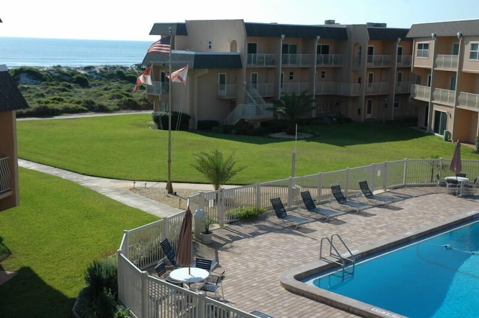 View from living room across pool to the ocean 