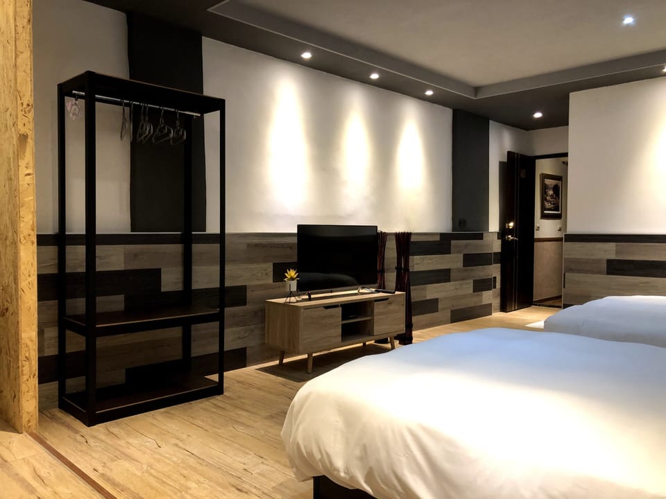 Deluxe Quadruple Room, Balcony | Down comforters, blackout drapes, soundproofing, rollaway beds
