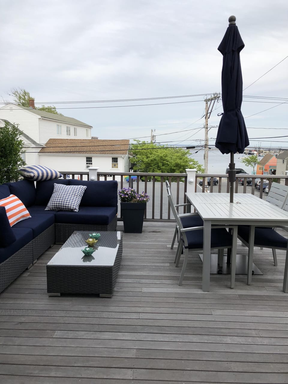 Spacious deck with outdoor seating, greenery and outdoor dining table!
