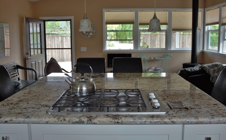 Huge granite island spans the great room for cooking, conversation and Netflix.
