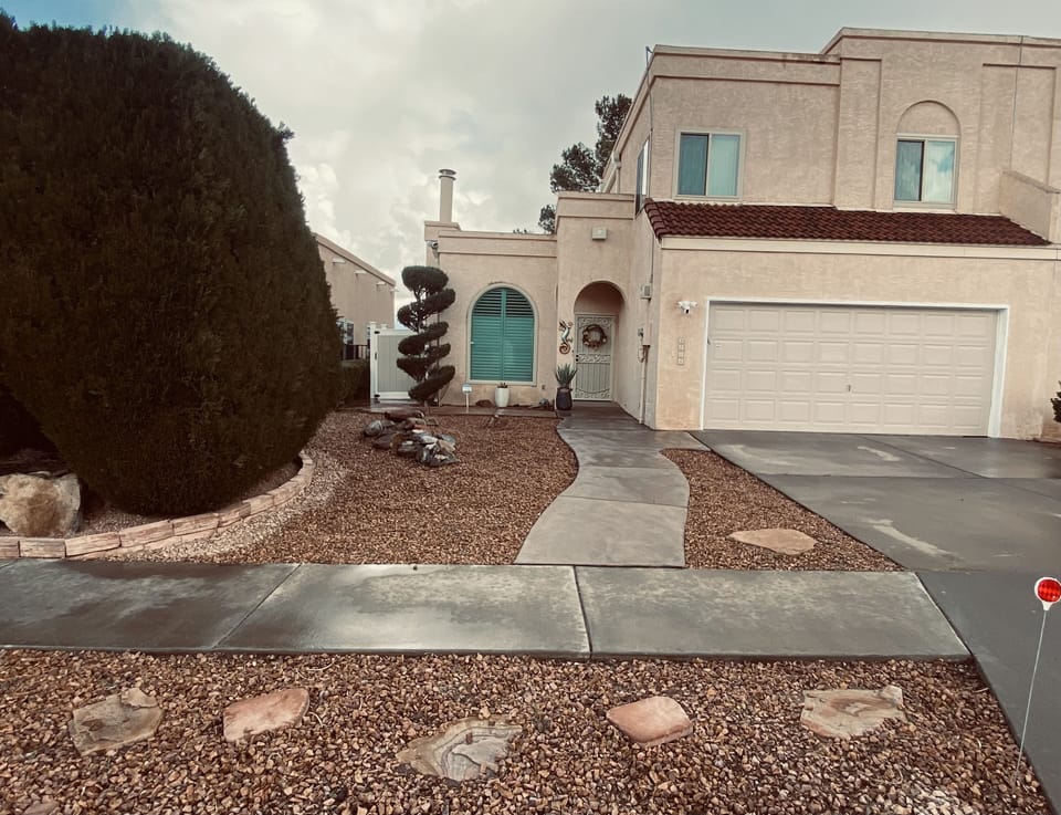 Street view of home, 2-car parking in driveway