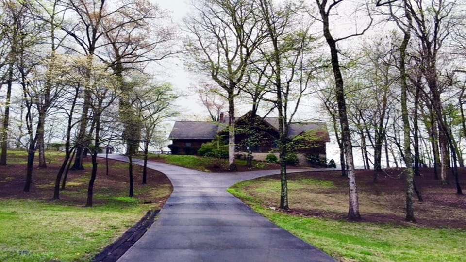 Gorgeous Log Home with a beautiful drive overlooking the lake.