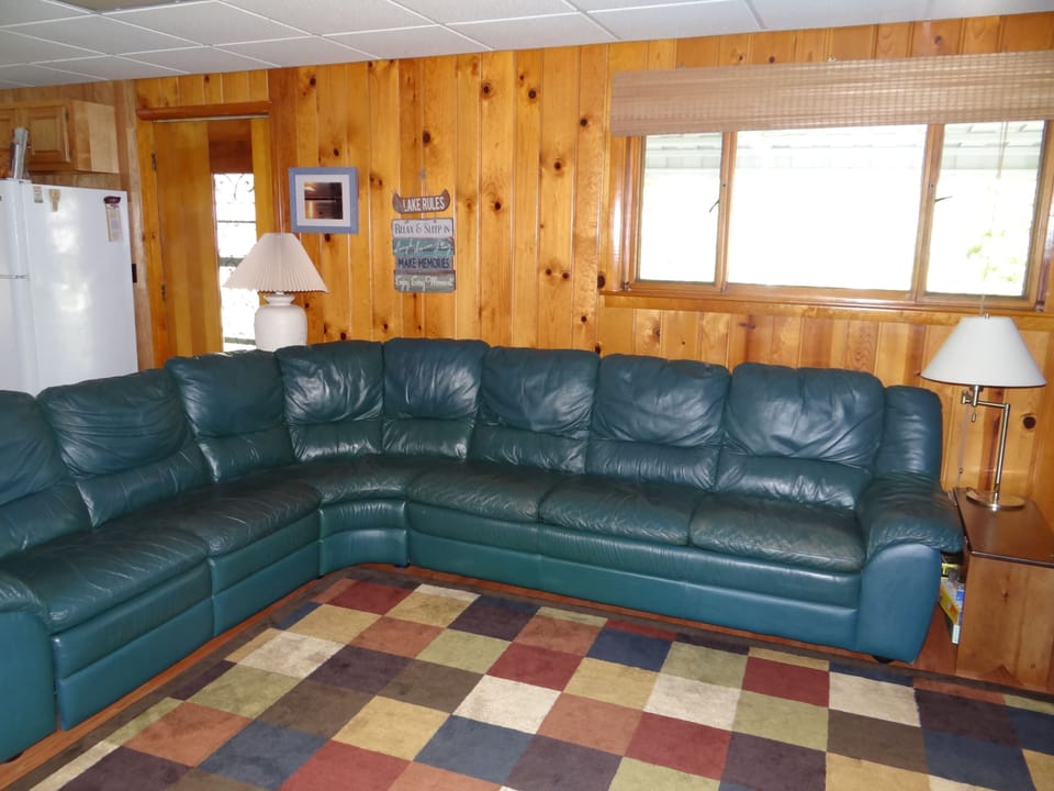 Large sectional with queen, pull out. Also, has a reclining end seat.