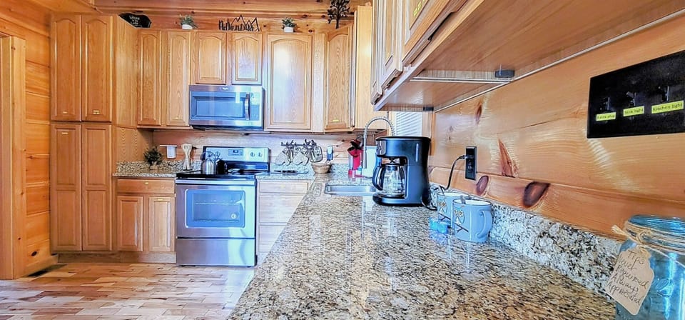 Spacious solid granite counter tops, full, Mr Coffee pot, double stainless sink with sprayer