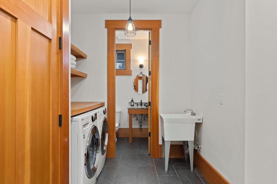 5th bathroom - main floor, door to the right leading to garage