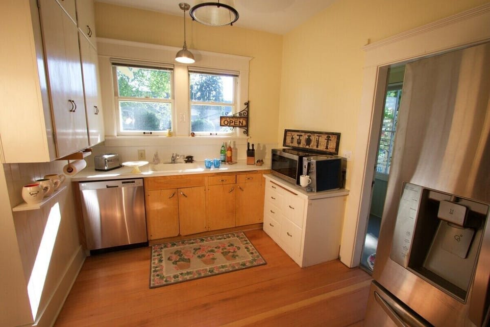 Kitchen with all new appliances, including stainless dishwasher, refrigerator, gas stove, microwave and drip coffee maker!