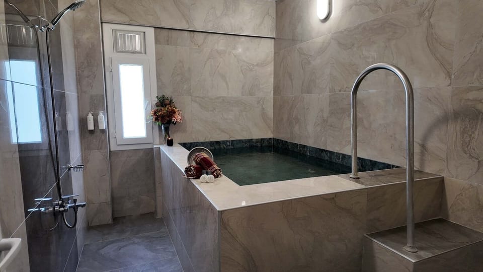 Apartment, 1 Bedroom | Bathroom | Bathtub, spring water tub, free toiletries, hair dryer