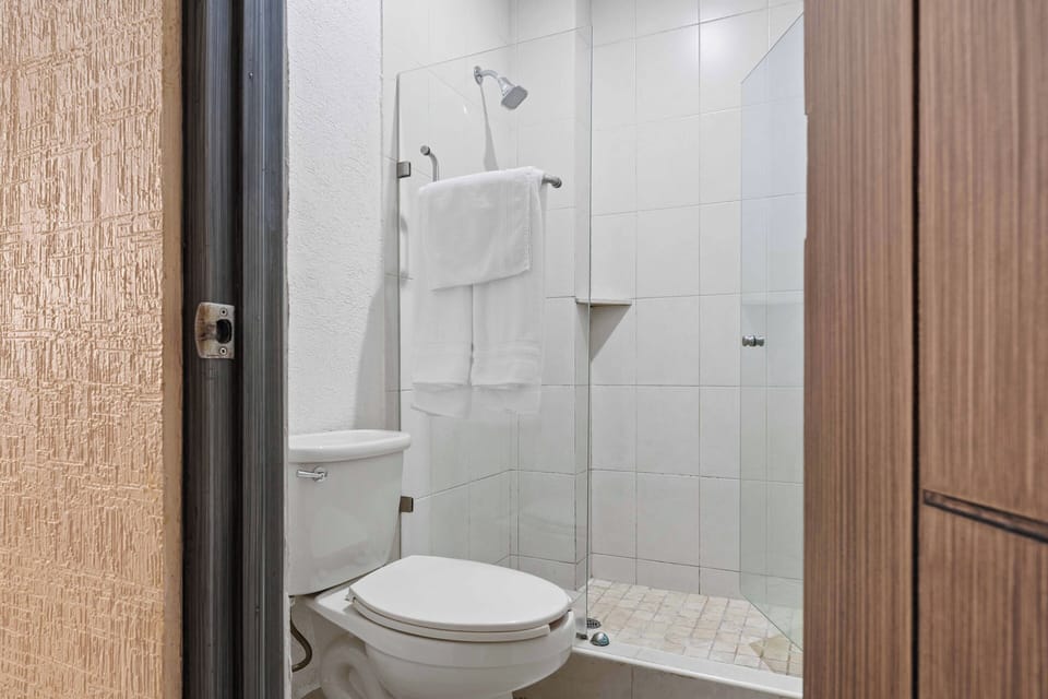Suite, 2 Double Beds | Bathroom | Shower, rainfall showerhead, free toiletries, hair dryer