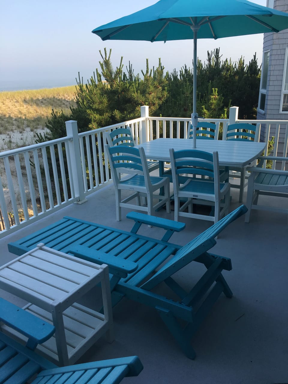 Lovely new outdoor patio table seats six and two chase lounges.