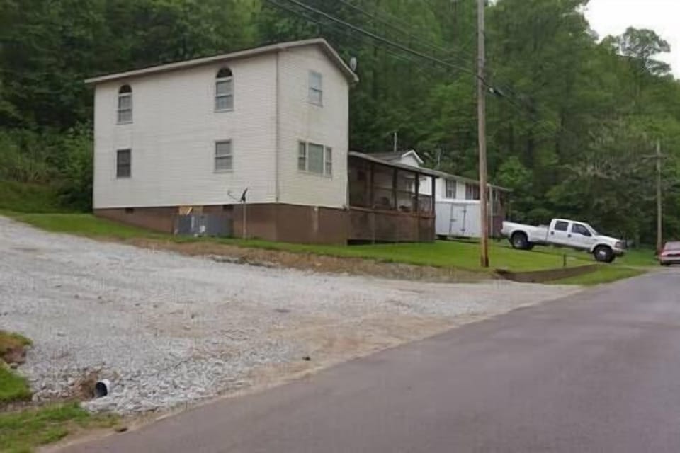 Side view of house and part of the second driveway 