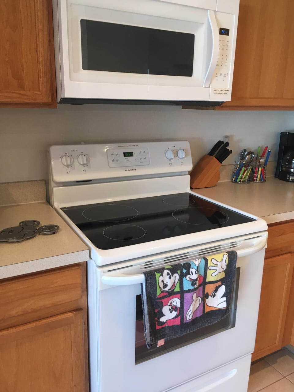 Glass top range with overhead microwave