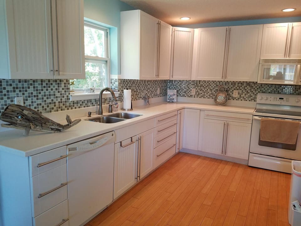 Kitchen has plenty of cabinets for your stay