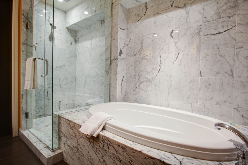 Deluxe Room, 1 King, Oceanfront | Bathroom | Shower, designer toiletries, hair dryer, bathrobes