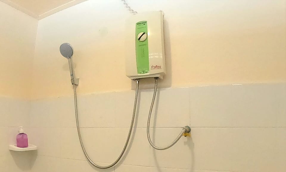 Standard Room (Fan) | Bathroom | Shower, towels, soap, shampoo