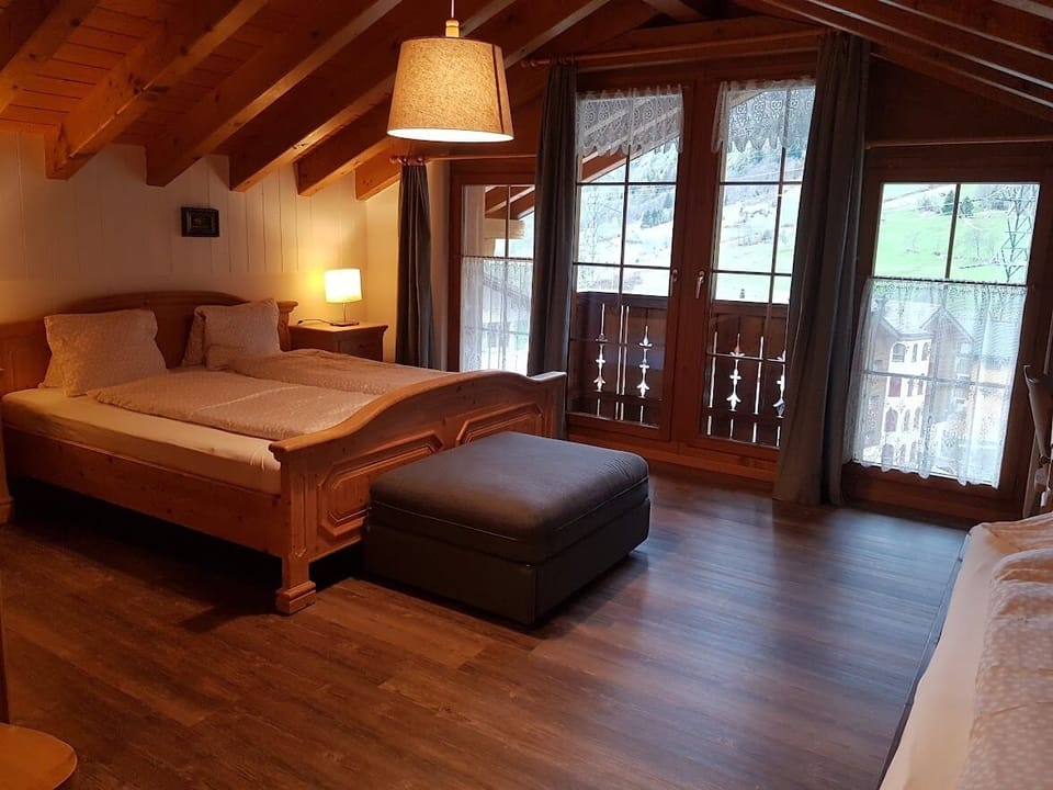Deluxe Quadruple Room, Mountain View | Desk, laptop workspace, blackout drapes, soundproofing