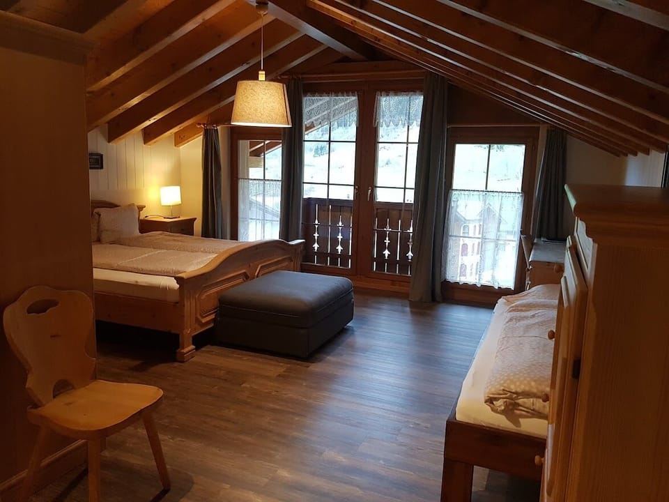 Deluxe Quadruple Room, Mountain View | Desk, laptop workspace, blackout drapes, soundproofing