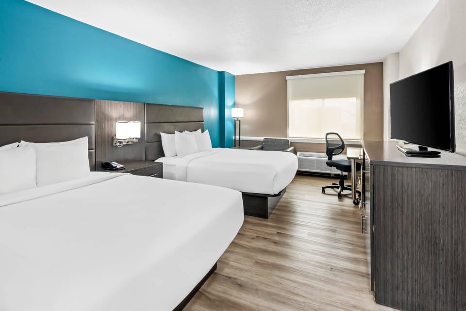 Standard Room, 2 Queen Beds, Non Smoking | In-room safe, desk, iron/ironing board, free WiFi