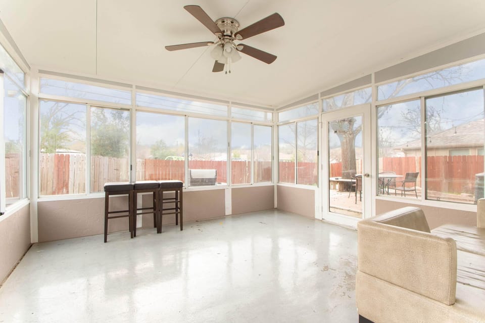 3 season sunroom with all windows and access to deck & public park behind house