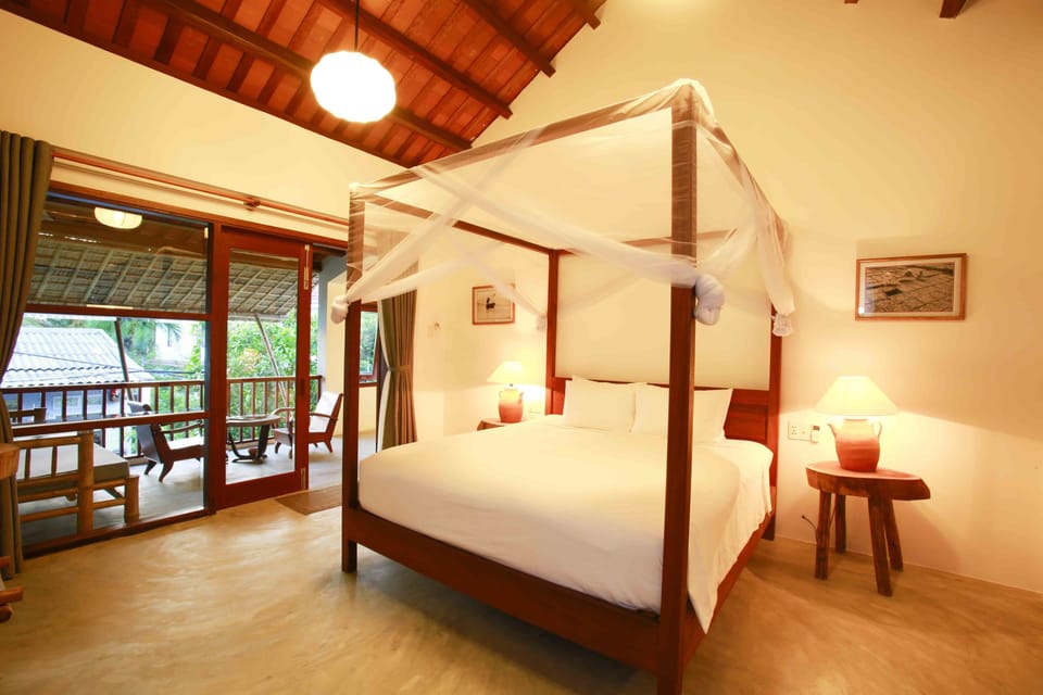 Deluxe Room, Garden View | Premium bedding, minibar, in-room safe, individually furnished