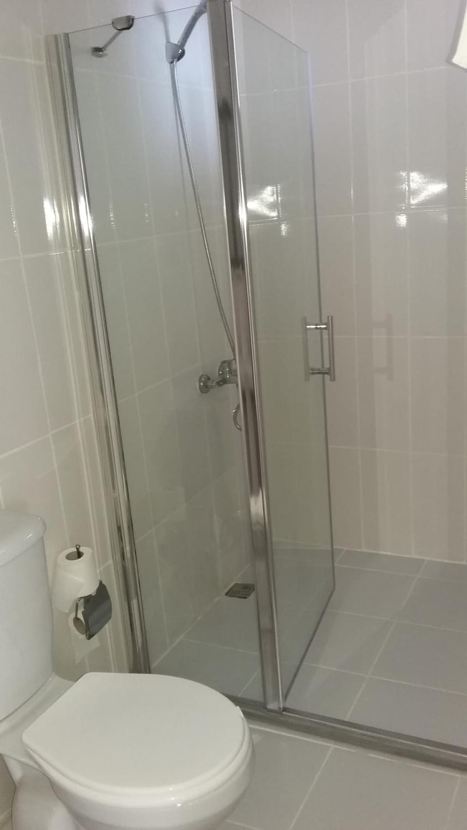 Shower, free toiletries, hair dryer, slippers