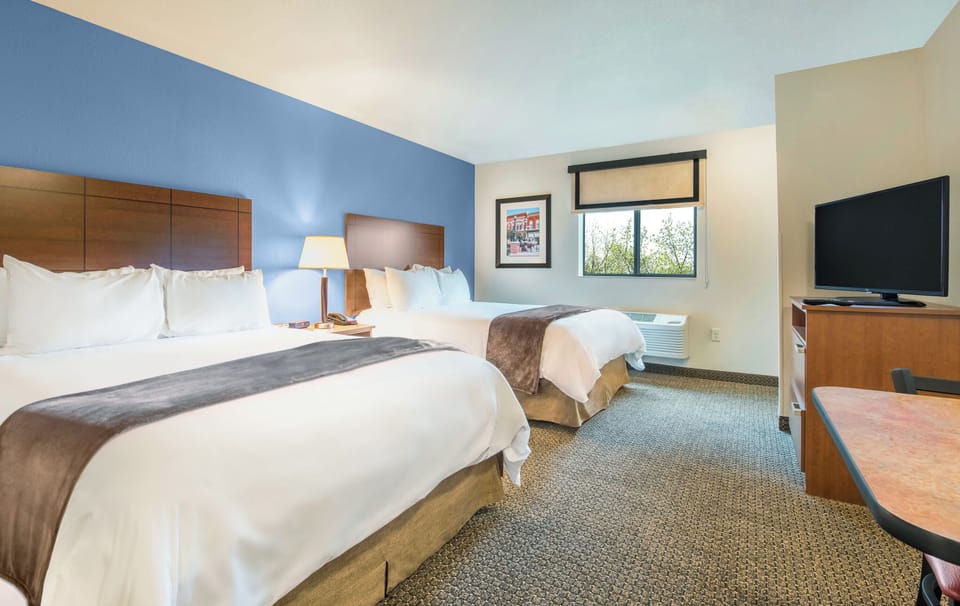 Premium bedding, pillowtop beds, desk, laptop workspace